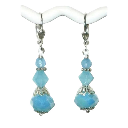 Pair of light blue beaded earrings on a white background