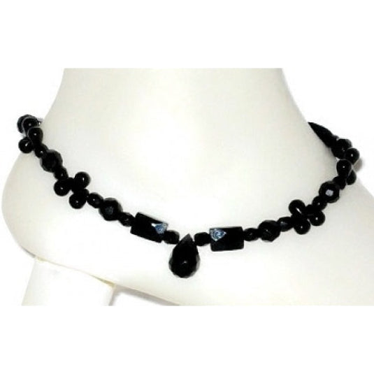 Black beaded ankle bracelet with onyx teardrop bead on a white mannequin ankle
