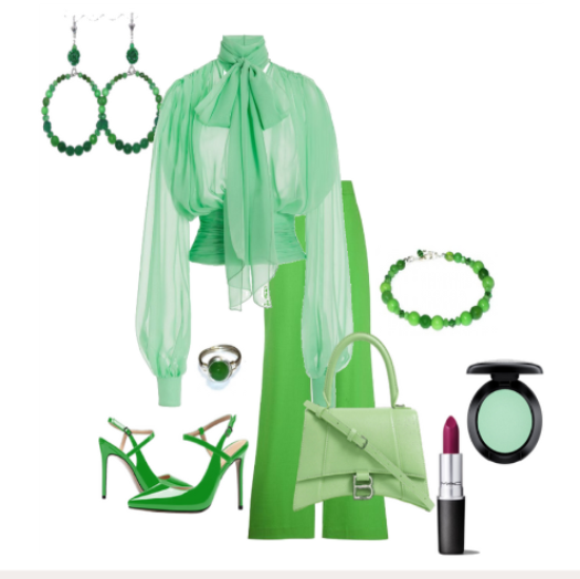 Green fashion set including top, pants, shoes, handbag, and accessories on a white background