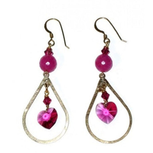 Pair of earrings with pink heart-shaped beads and gold teardrop designs on a white background