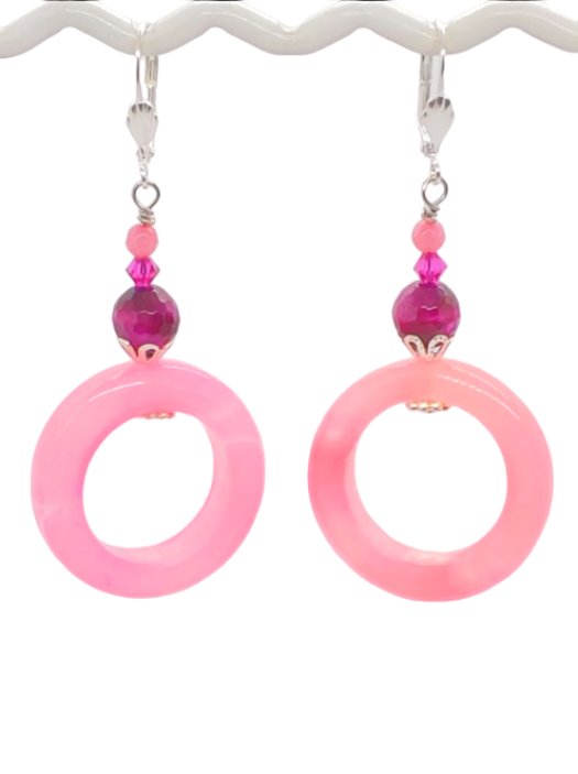 Pink hued gemstone beaded hoop earrings with beaded accents on a white background