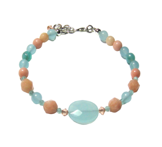 Handcrafted beaded bracelet with pastel-colored beads on a white background