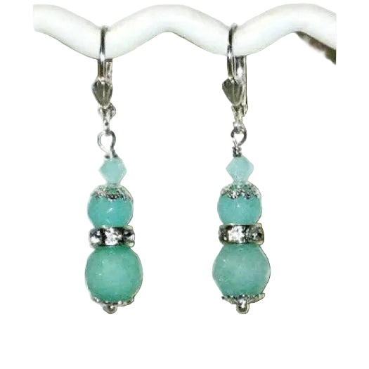 Mint green seafoam beaded dangle earrings on a white background