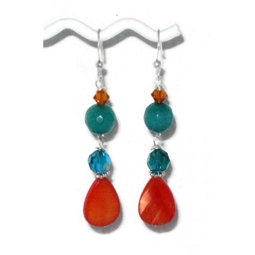 Pair of teal and orange dangle earrings made with crystals, mother-of-pearl and jade-style gemstone beads on a white backgrround