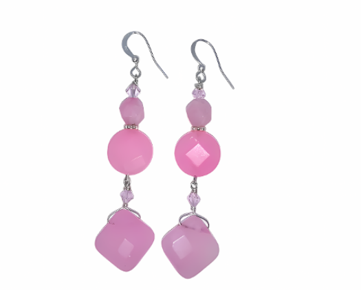 Elegant pink beaded earrings on a white background