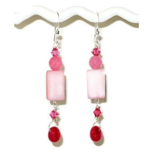 Pair of delicate pink and raspberry dangle earrings on a white background