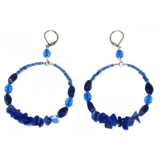 Pair of blue beaded hoop earrings on a white background