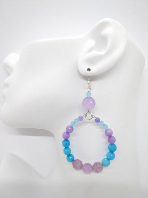 Beaded Hoop sky blue beads on a mannequin ear.