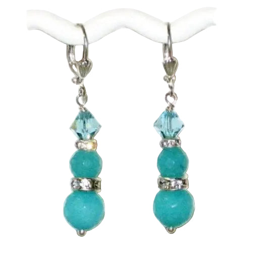 Teal beaded drop earrings with crystals on a white background