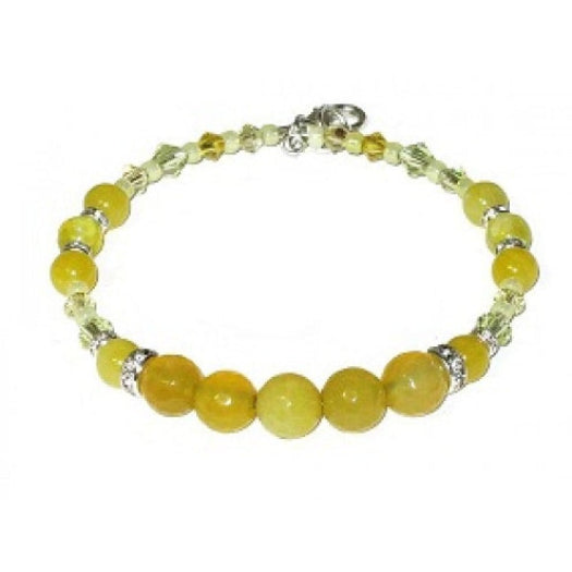 Yellow beaded bracelet with crystals, jades-style gemstone beads, silver rhinestone rondelle beads on a white background