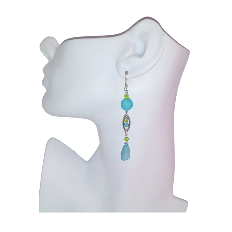 Aqua and peridot green crystal 3 inch long dangle earring made with chalcedony, faceted jade beads and crystals displayed on a mannequin ear with a white background