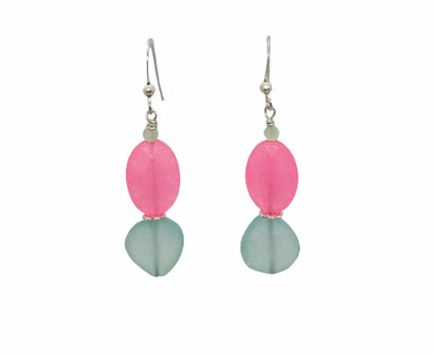 Pair of earrings with pink and green beads on a white background