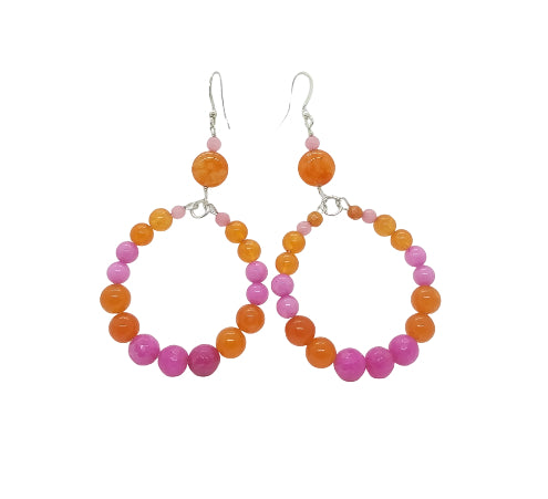 Hoop earrings with pink and orange beads on a white background
