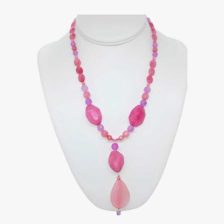 Handmade 18-inch pink and purple lavender gemstone statement necklace with 3.5 inch faceted pendant drop and crystal accents on a white display form