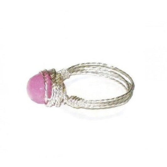 Silver-plated ring with a pink gemstone on a white background