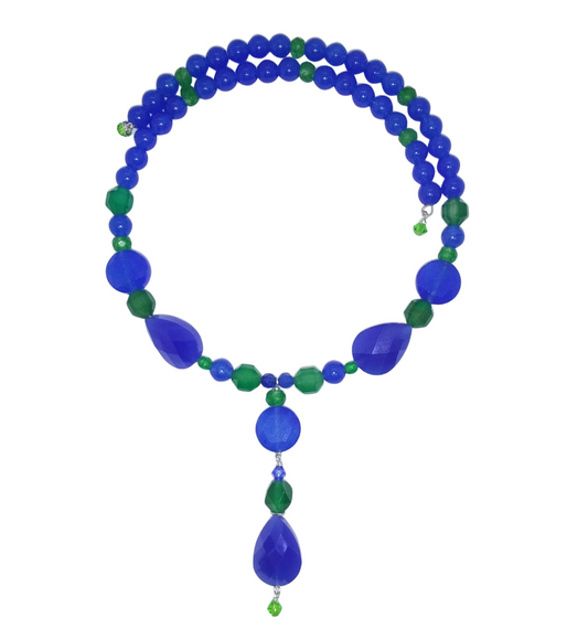 A beaded choker featuring royal blue and emerald green gemstone beads, with larger faceted blue teardrop beads and a matching blue teardrop pendant, displayed on a clean white background.