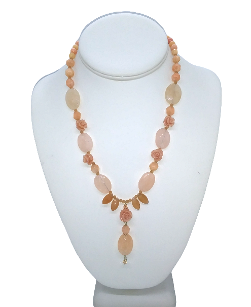 Delicate Peach Necklace with Carved Floral Accents and Drop Pendant