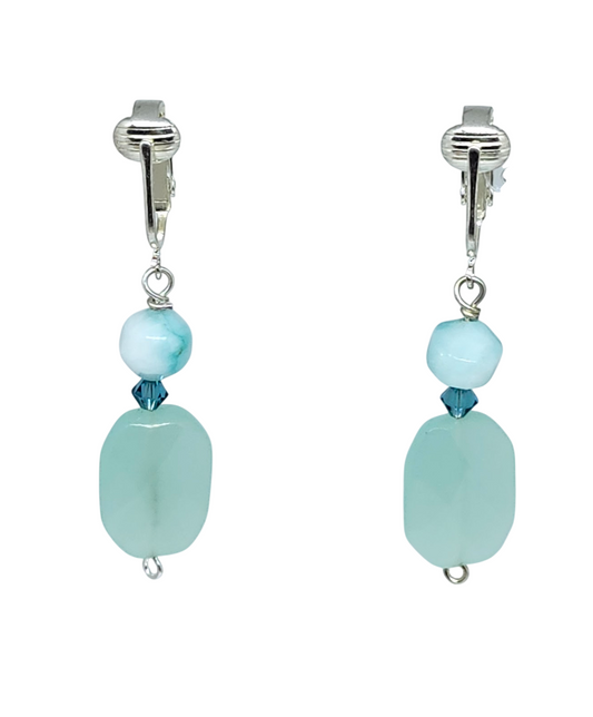 Clip-on earrings with aqua and seafoam green semi-precious stones and teal bicone crystals and silvertone ear clips.