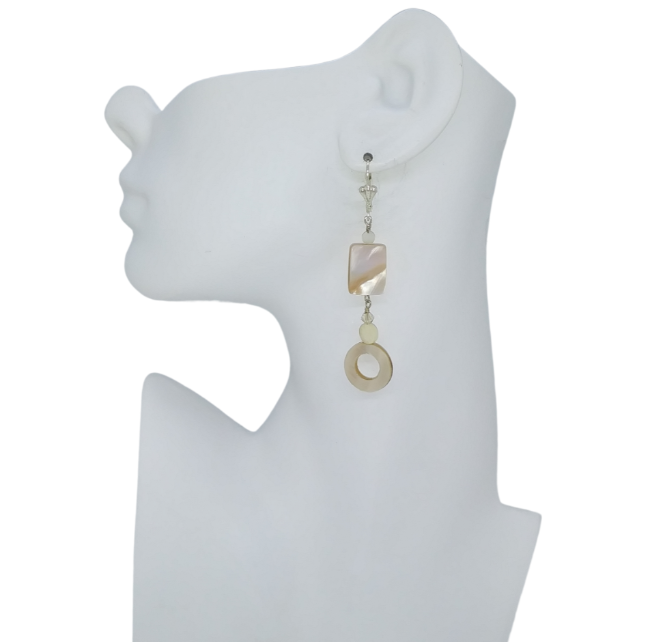 Handmade beige, ivory and cream dangle earrings with silver-plated Leverback on mannequin ear