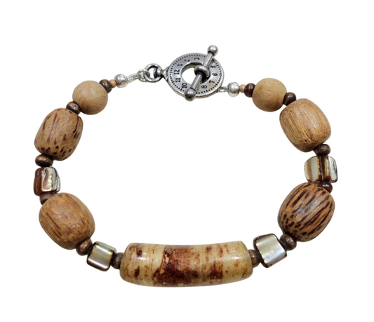 A beaded men's bracelet featuring natural wood beads, a large central carved Jasper stone cylinder, and a silver-toned toggle clasp on a white background.