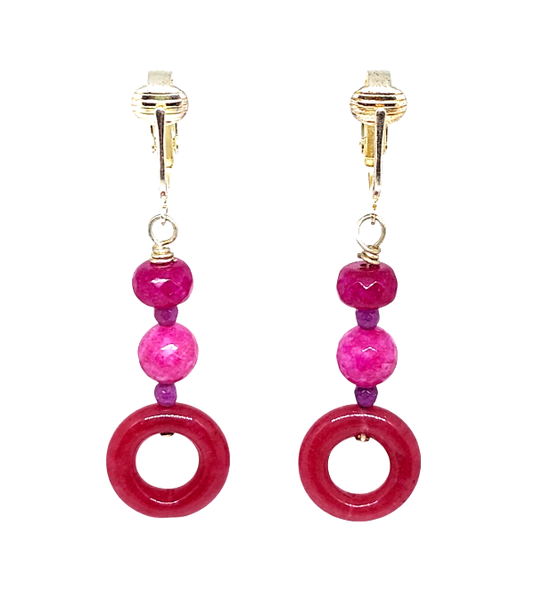 Fuchsia and purple jade clip-on earrings with faceted and donut-shaped beads.