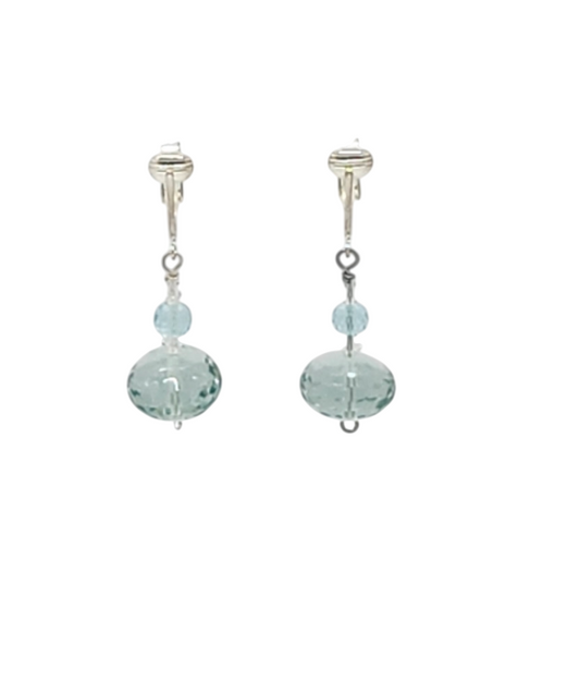 A pair of silver-toned dangle earrings featuring faceted aqua quartz beads, shown against a plain white background.