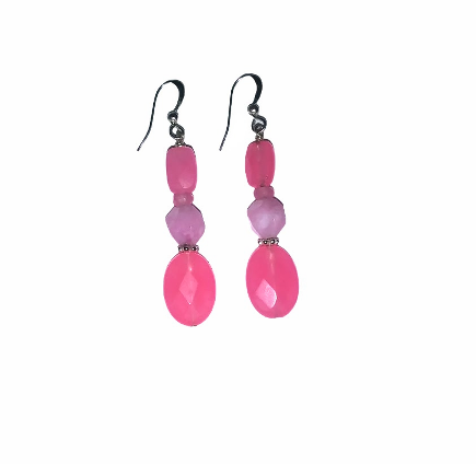 Pair of pink beaded earrings on a white background