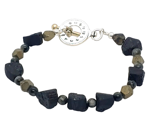 Men's bracelet with dark beads and a watch face charm on a white background