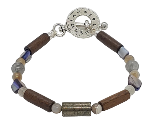 Men's bracelet with wooden and beaded elements on a white background