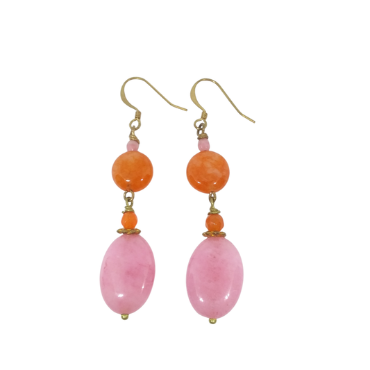 A pair of orange and pink dangle earrings with gold-tone components against a plain white background.