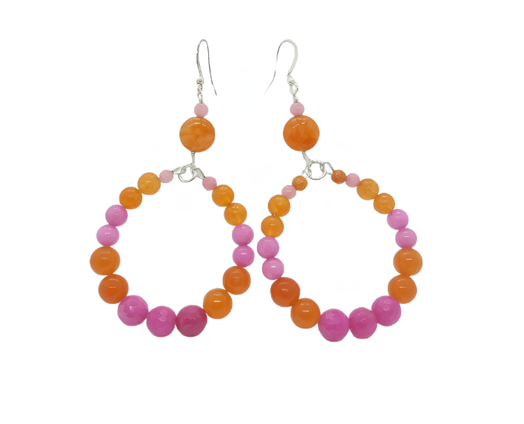 Pair of hoop earrings with pink and orange beads on a white background