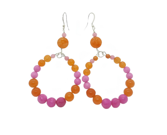 Pair of hoop earrings with pink and orange beads on a white background