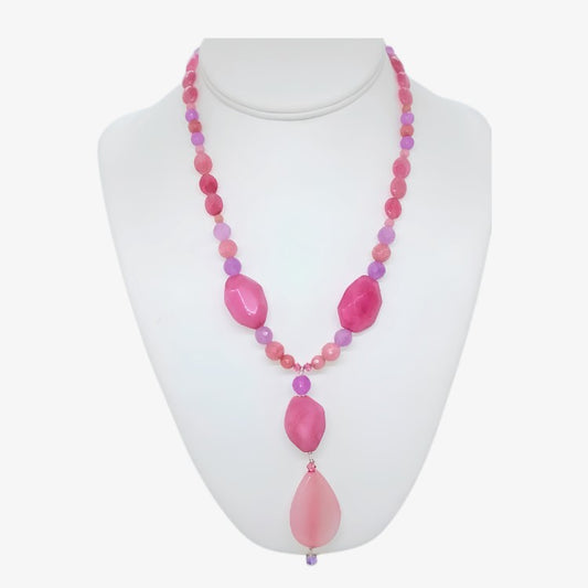 Handmade 18-inch pink and purple lavender gemstone statement necklace with 3.5 inch faceted pendant drop and crystal accents on a white display form