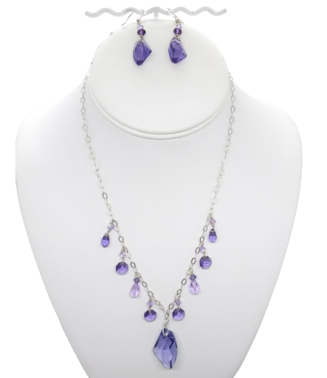 Delicate purple Crystal and sterling silver chain necklace and earrings set displayed on a white mannequin necklace display
