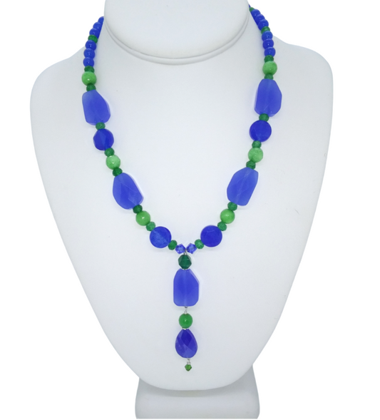 Handmade royal blue and green beaded statement necklace with a 2 7/8-inch dangling pendant, jade-style beads, and chalcedony accents.