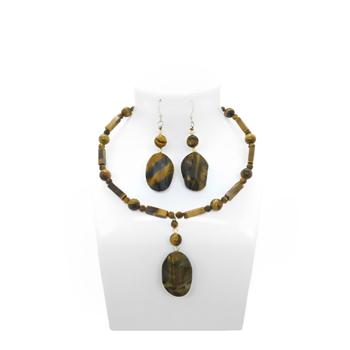 Brown Jewelry set with necklace and earrings on a white stand



