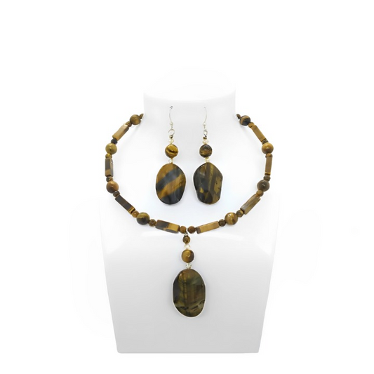 Brown Jewelry set with necklace and earrings on a white stand




