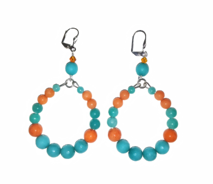 Pair of teal and orange hoop earrings with Jade beads on a white background